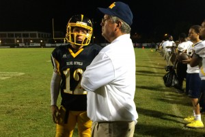 ((Tate with his Dad, Charlie. Photo courtesy of polkcountyfootball.com))