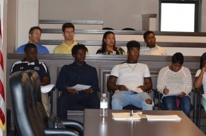 PARENTS AND STUDENT-ATHLETES LISTENING TO DERRICK EDMONDS