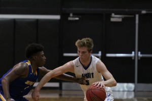 Jesuit's Stevie Darst dribbles against a Jefferson defender at Robinson High School in Wednesday's 6A-9 Semi-Final. He led all scorers on the evening with 22 points.