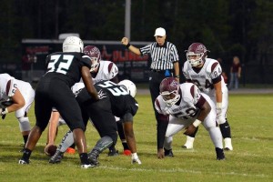 Chase Oliver (24 in white) stands ready for the snap against Sunlake last October.